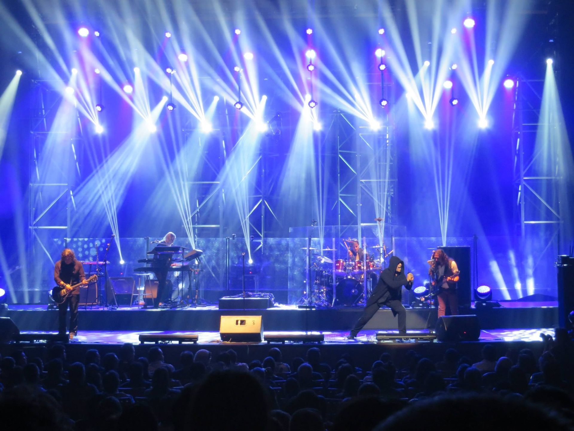 A band performing live on a concert stage